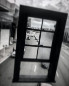 framed view of a street with cars